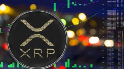 XRP coin in front of a digital trading chart representing XRP Price Prediction $500 and future crypto market analysis.