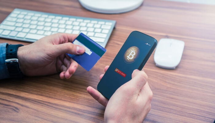 Step-by-Step Guide to Buying Bitcoin with Credit Card 1 - Incryptocoin Mobile phone and credit card showing the easy process of buying Bitcoin with Credit Card on a smartphone.