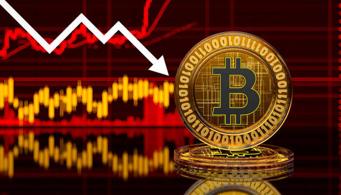 Bitcoin Crash 1 - Incryptocoin Bitcoin coin on top of a declining graph, symbolizing the sharp fall in value during the Bitcoin crash.