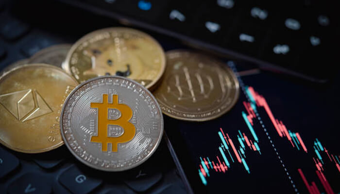 Bitcoins Influence on Other Cryptocurrencies 1 - Incryptocoin Close-up of Bitcoin coins, Ethereum, and a declining crypto market graph, showcasing the effects of the Bitcoin crash on cryptocurrency.